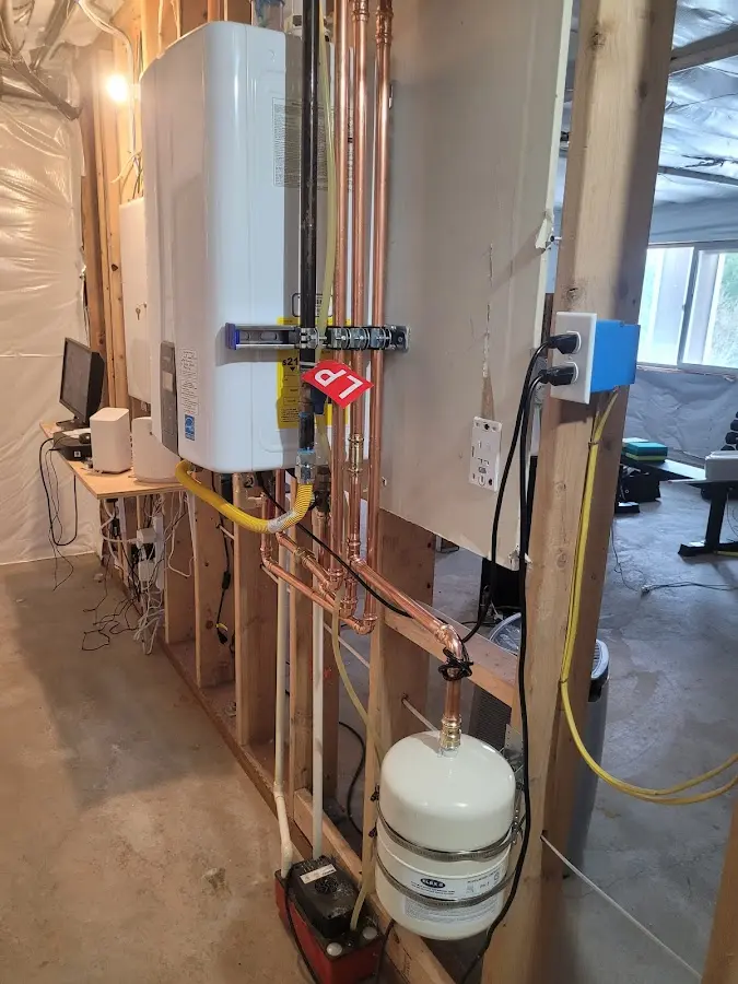 Licensed plumber repairing a kitchen sink in Brielle