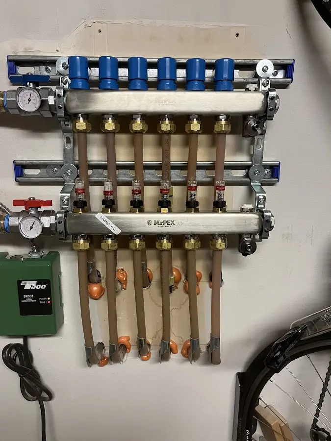 Plumber performing Water Heater Repair at a residential property in Brielle